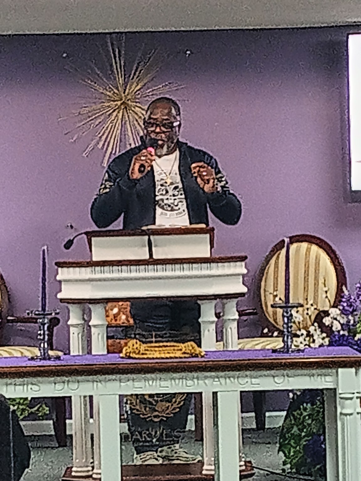 Pastor preaching at NBM